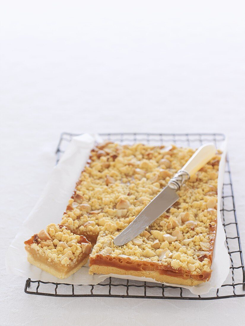 Caramel macadamia cake on cake rack