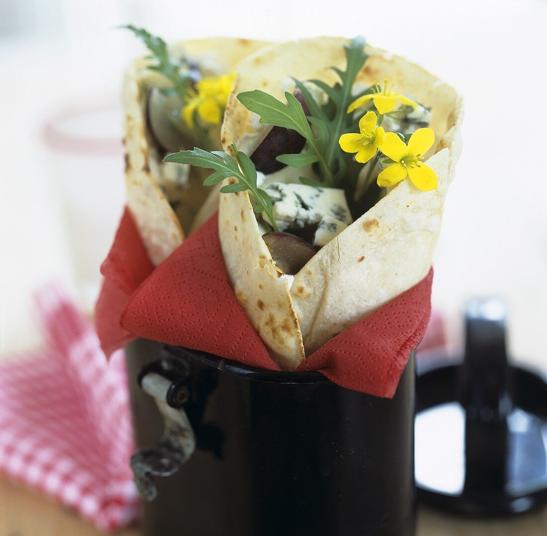 Wraps filled with cheese and rocket