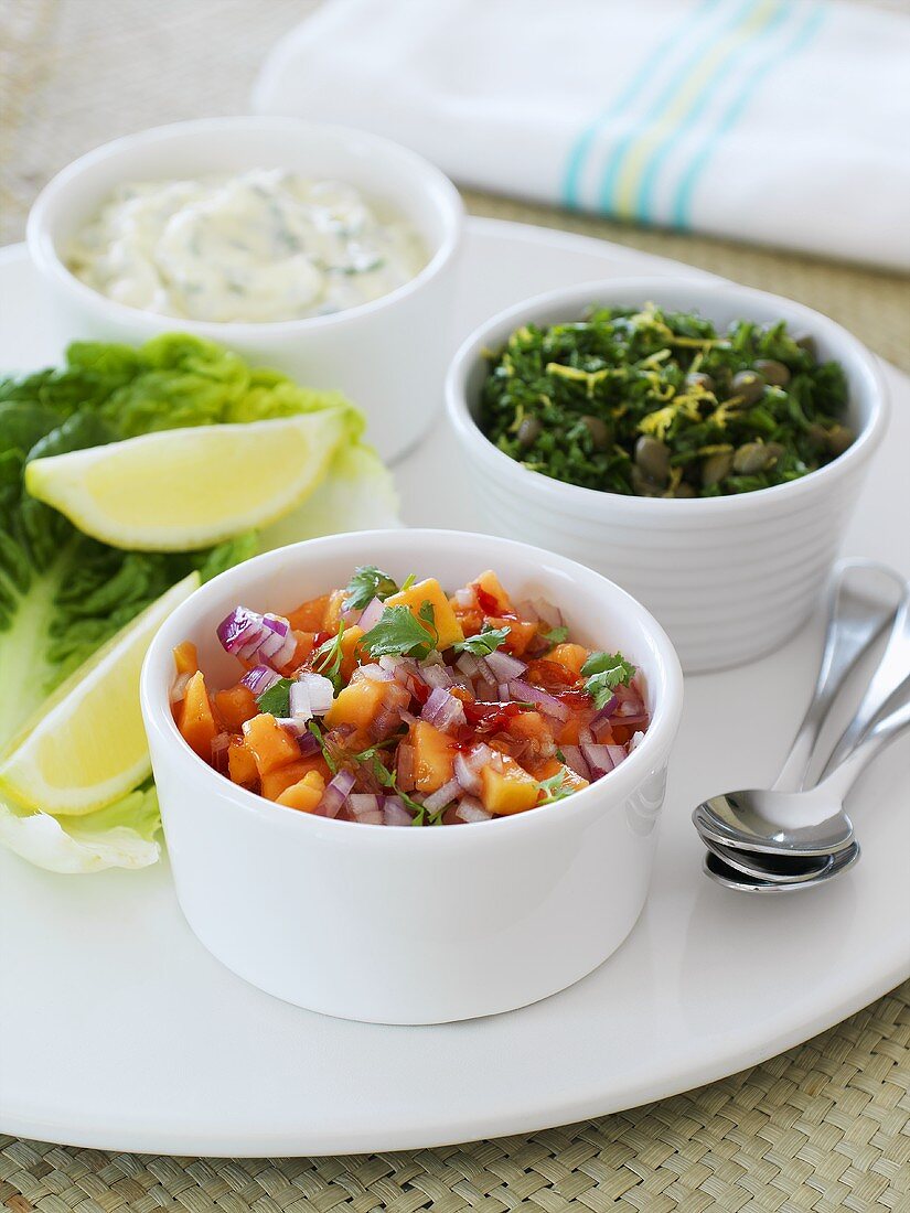 Papaya and onion salsa, herbs with capers and herb quark