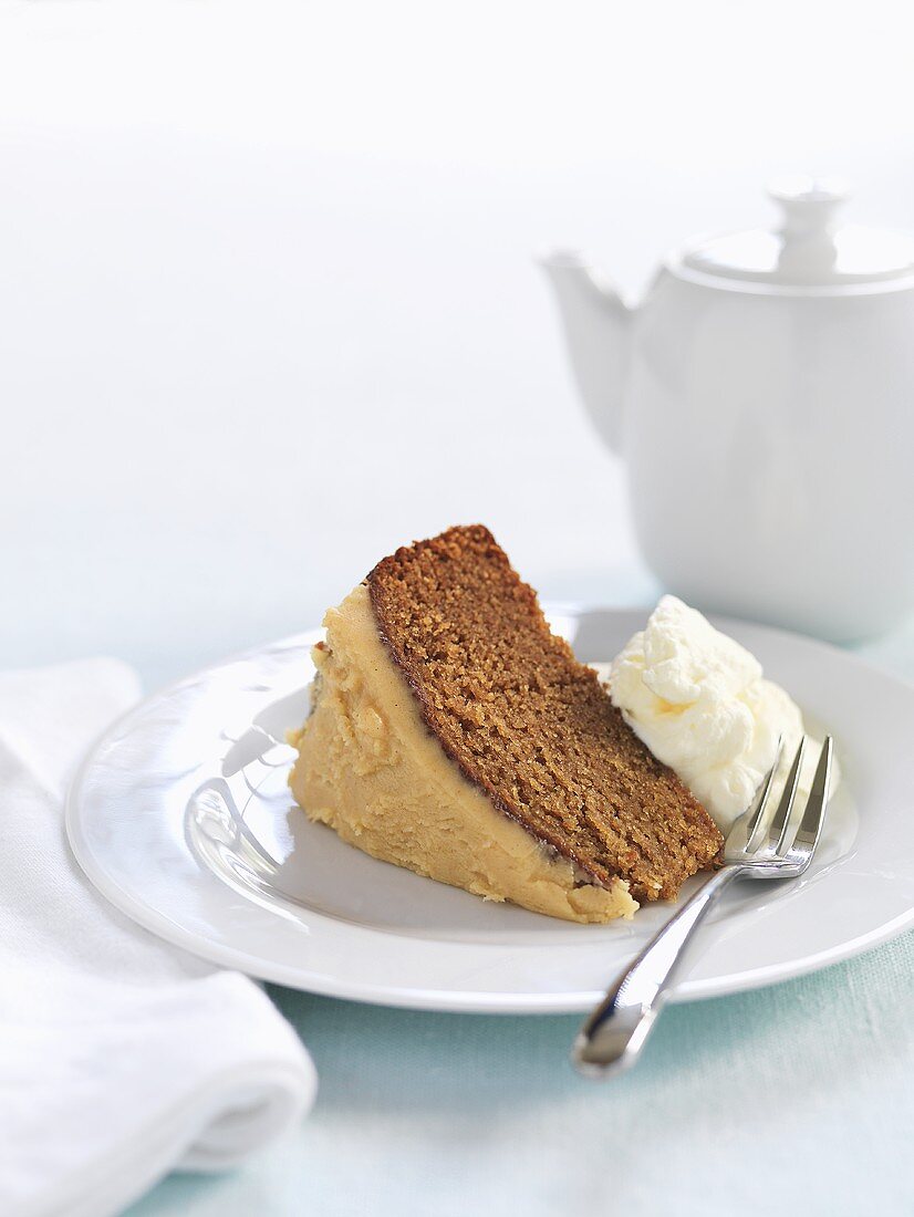 A piece of ginger cake with cream
