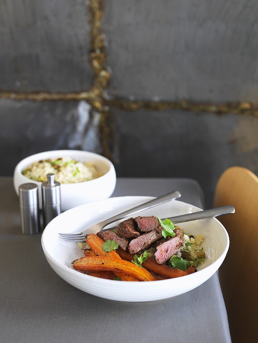 Moroccan lamb fillet with carrots on couscous