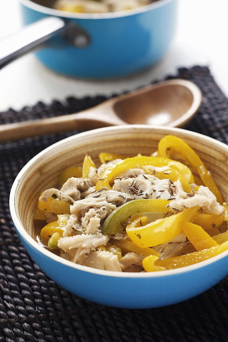 Tripe with strips of yellow pepper and caraway seeds