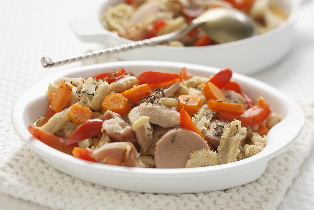 Tripe with strips of red pepper, carrots and sausage