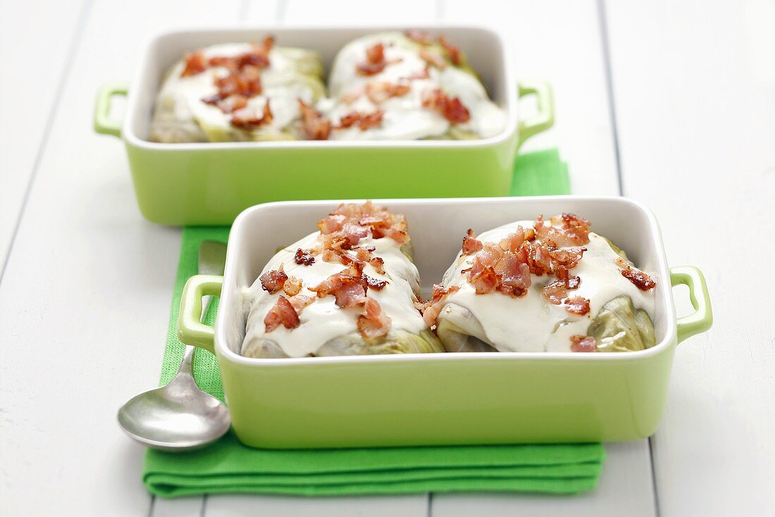 Stuffed cabbage leaves with buckwheat stuffing, sour cream, bacon