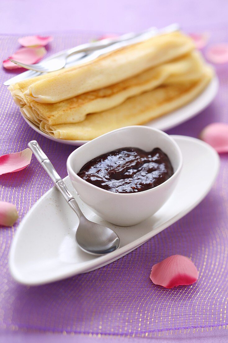 Plum jam with cocoa powder and pancakes
