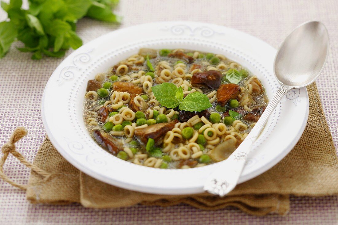 Mushroom soup with peas and noodles