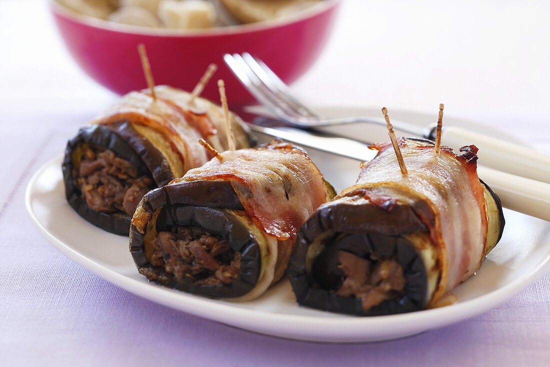 Bacon-wrapped aubergine rolls with mushroom stuffing