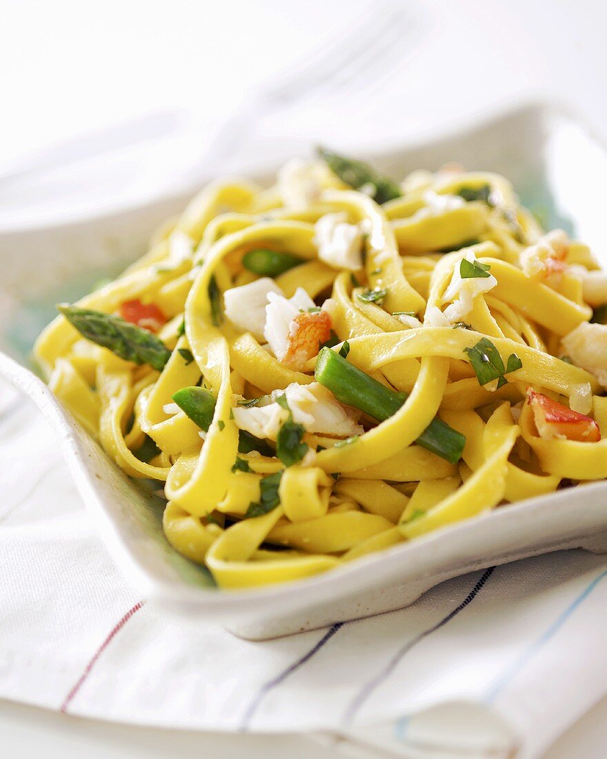 Home-made fettuccine with vegetables and crabmeat