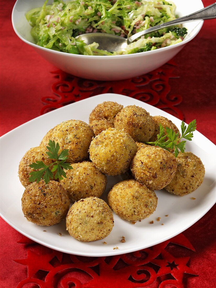 Deep-fried potato balls as a side dish … – License Images – 378628 ❘ StockFood