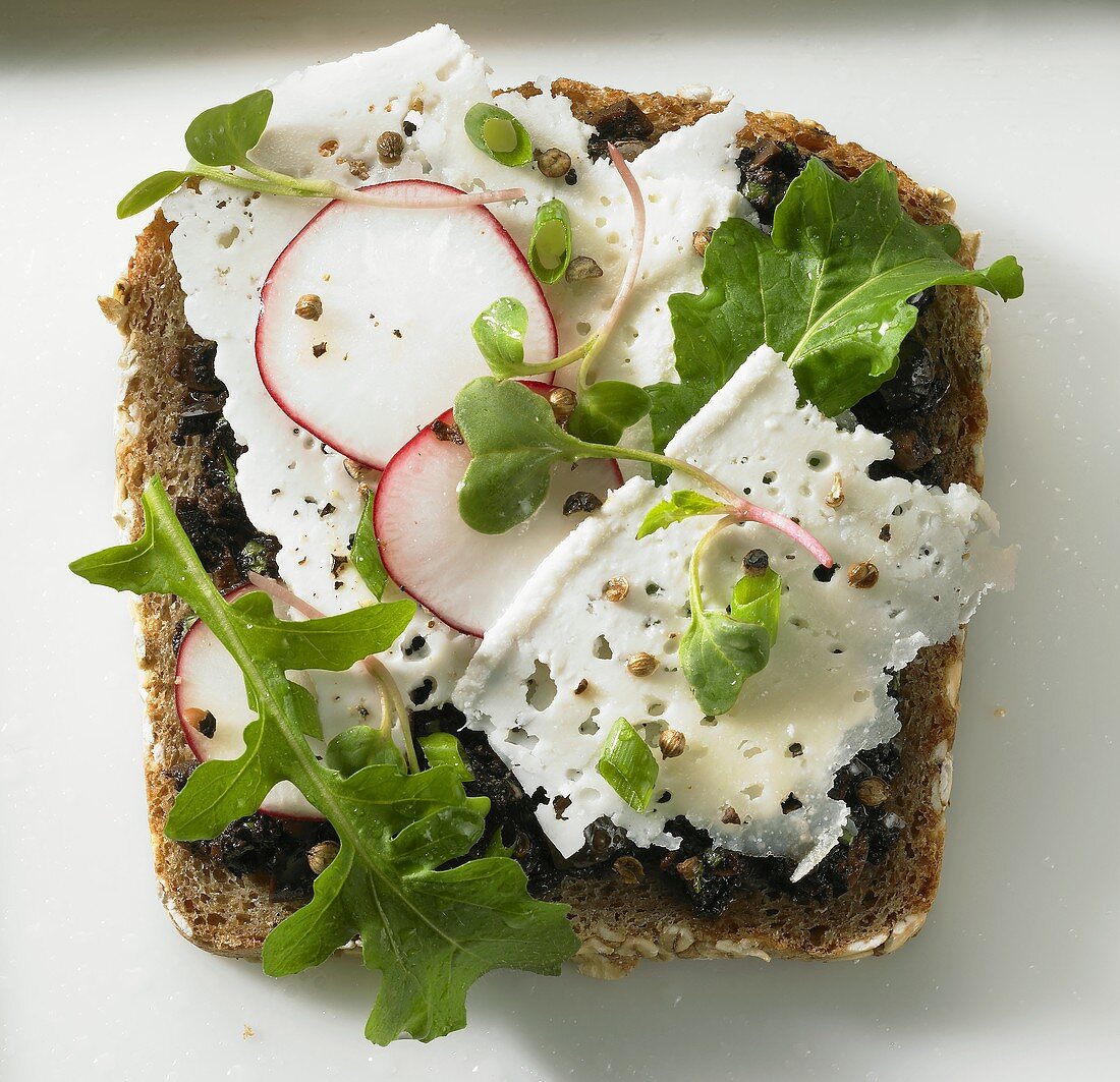 Feta cheese and radishes on black bread