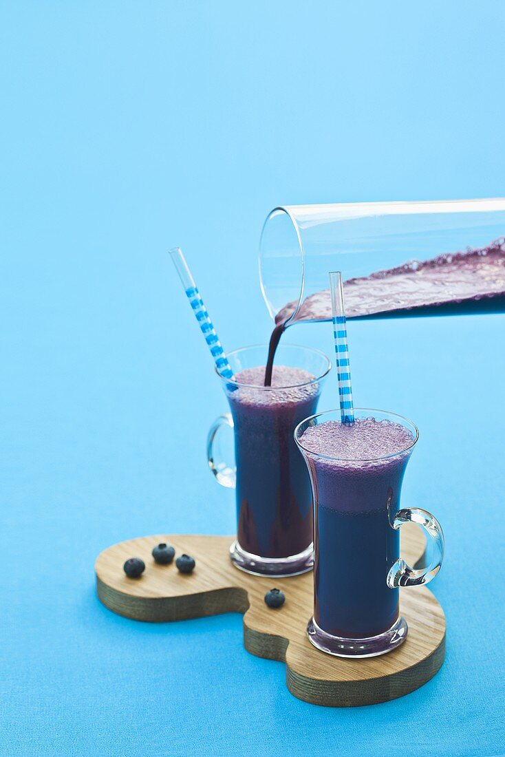 Pouring blueberry shake