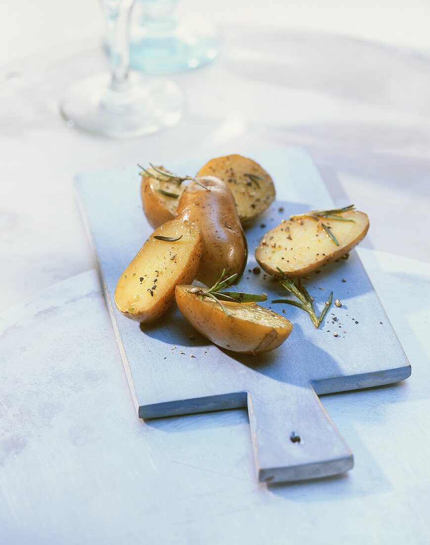 Rosemary potatoes on wooden board