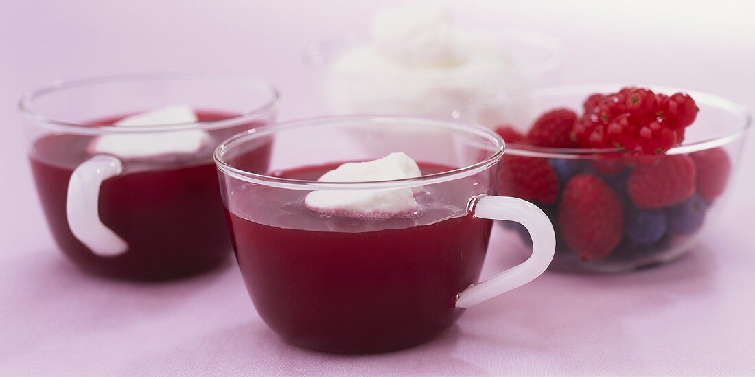 Cold berry soup with blobs of cream