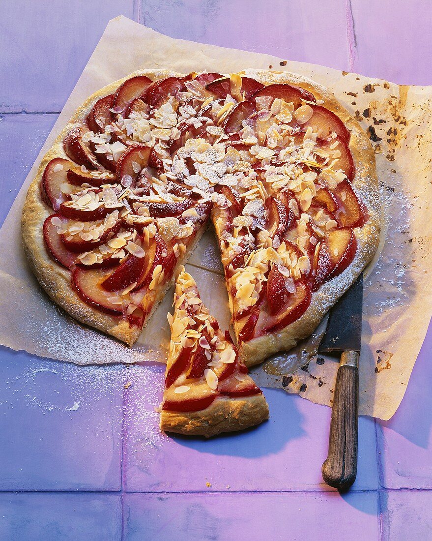 Plum cake on baking parchment