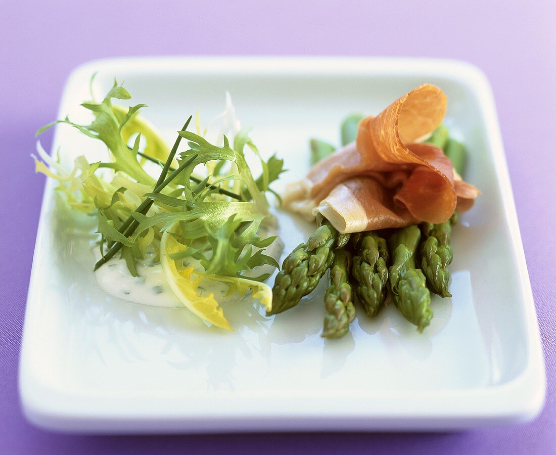 Green asparagus with Parma ham and salad garnish