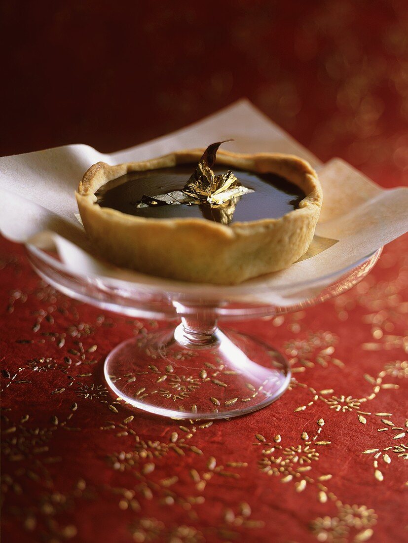 Chocolate tartlet with gold leaf