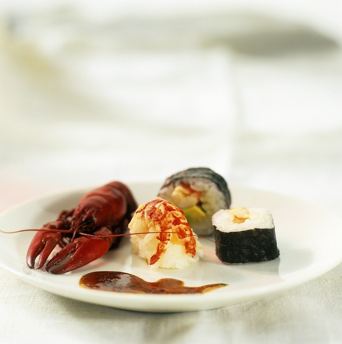 Nigiri sushi, maki sushi and cooked freshwater crayfish