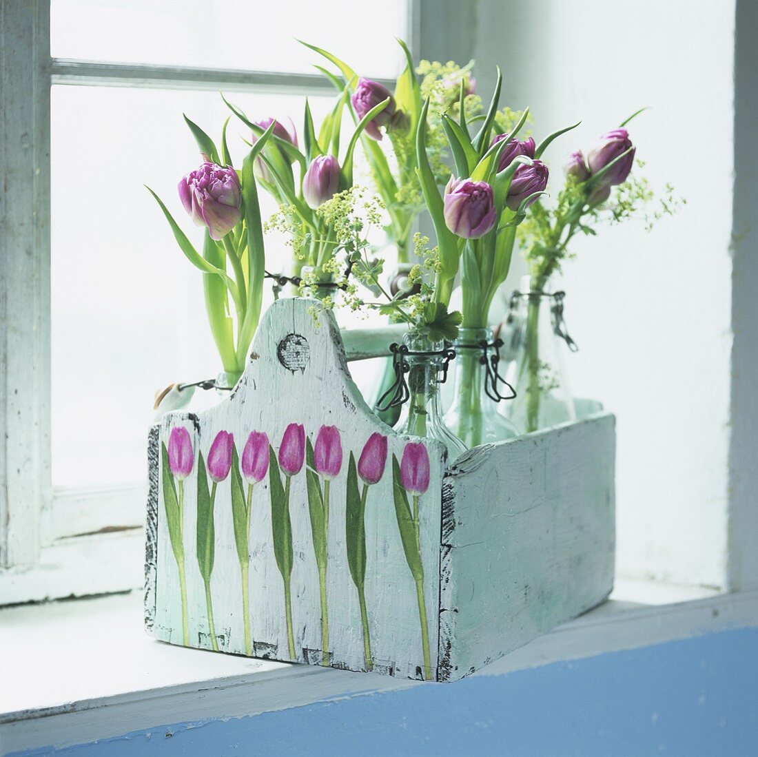 Tulips in flip-top bottles