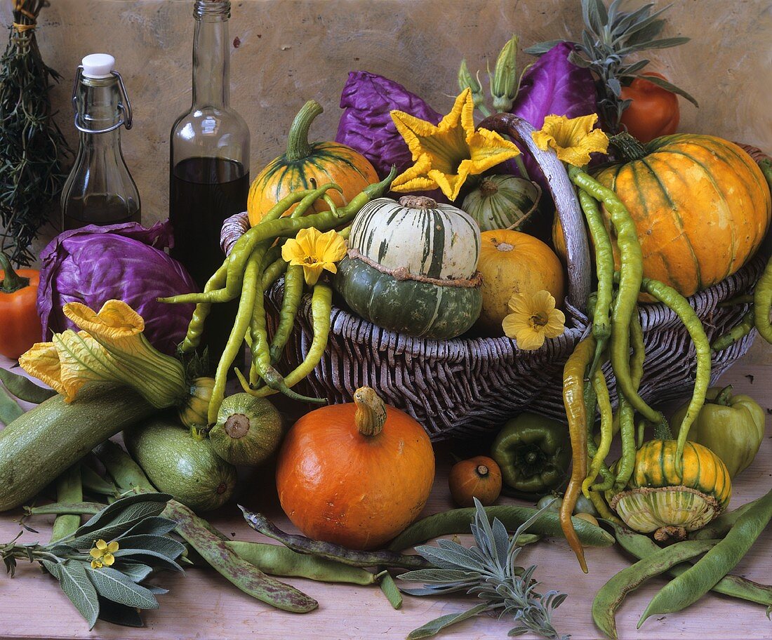 Still life with squashes, beans and chillies