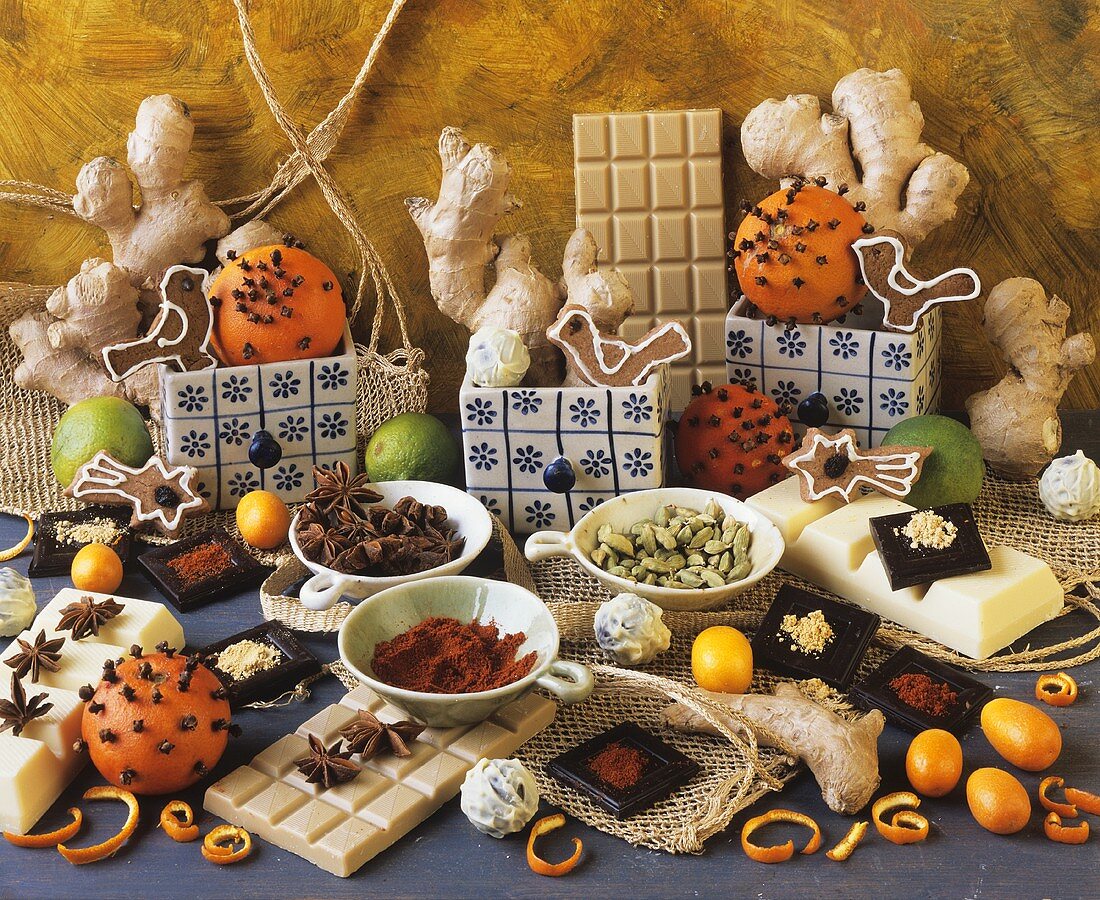Still life with chocolate, spices and studded oranges