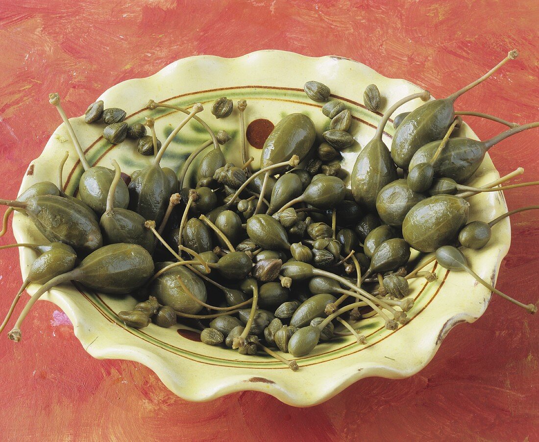 Capers and caper berries on a plate