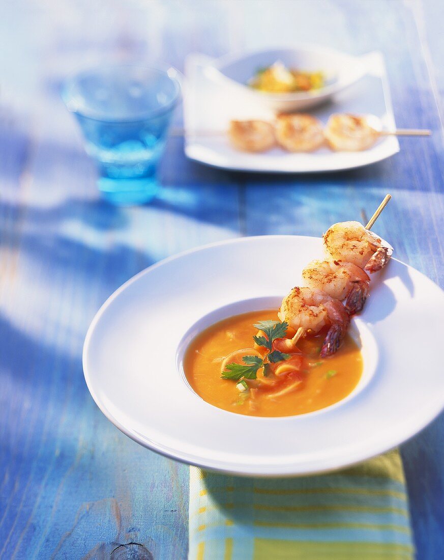 Pumpkin soup with prawn skewer