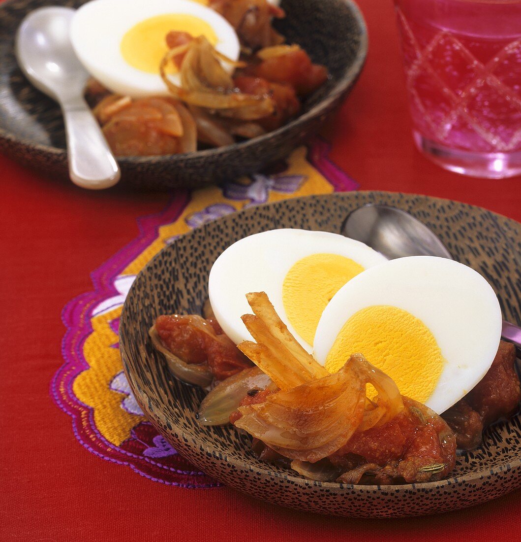 Boiled eggs on a bed of onion