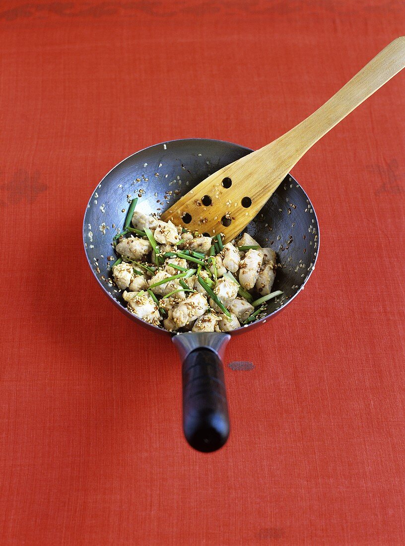 Stir-fried chicken with sesame seeds and chives
