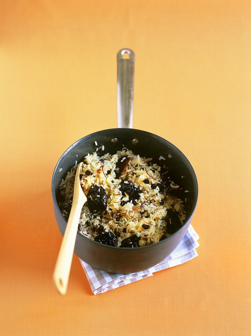 Rice with prunes, dates, almonds and saffron