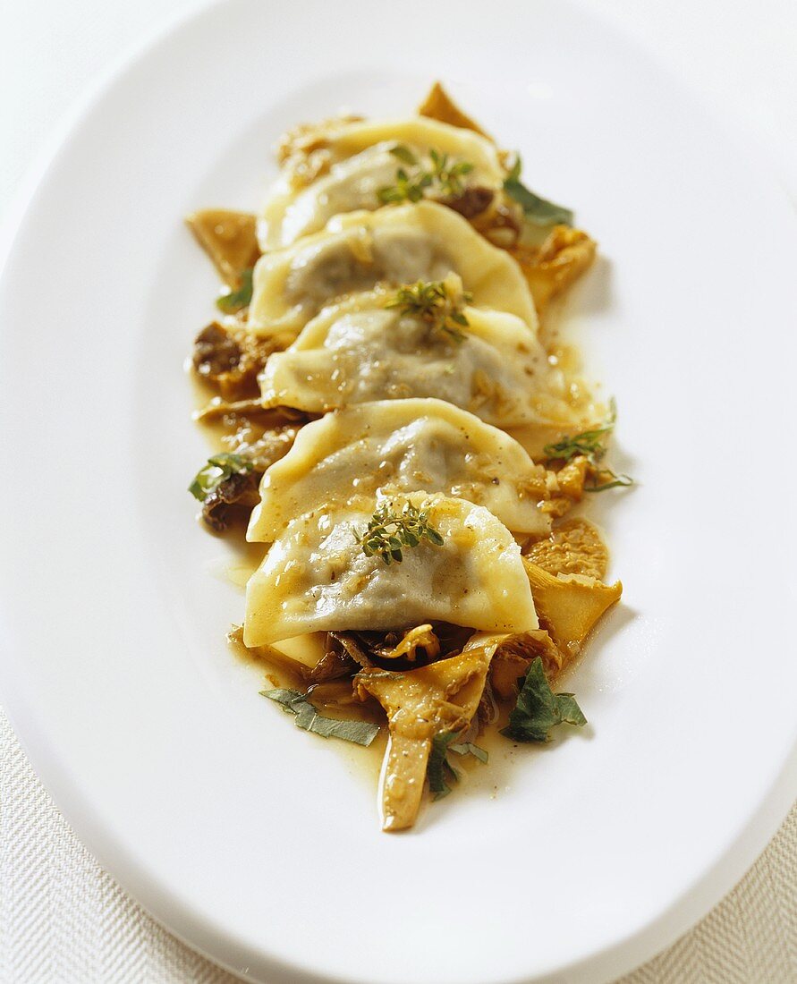 Ravioli with black chanterelle filling and chanterelles