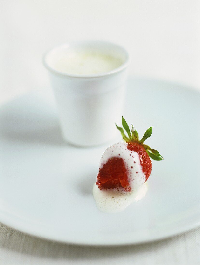 A strawberry with cream