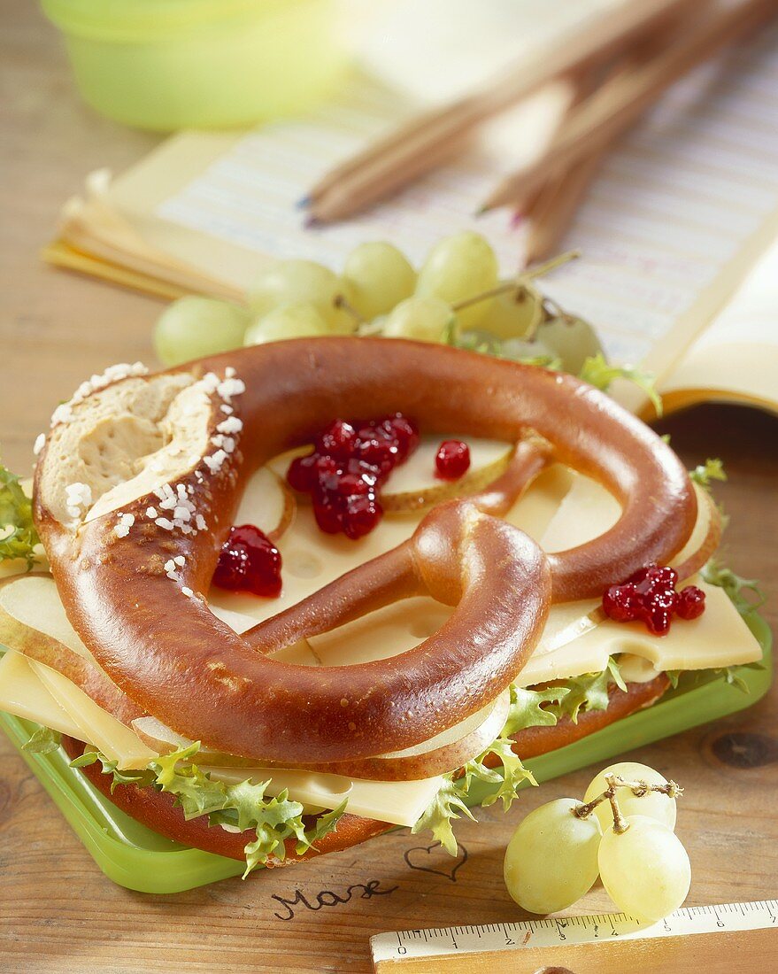 Cheese and pear slices in pretzel