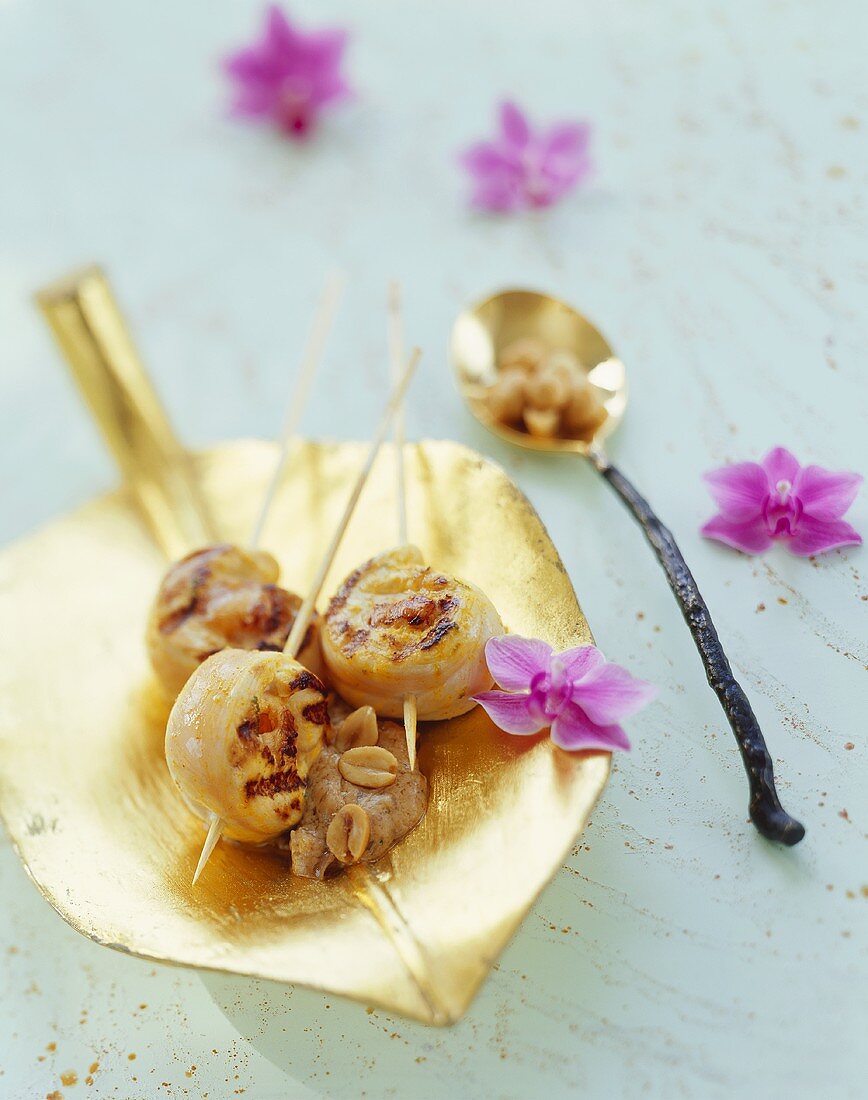 Chicken skewers with lychees and peanut dip