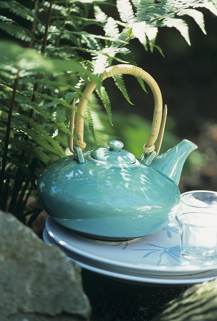 Asian teapot in garden