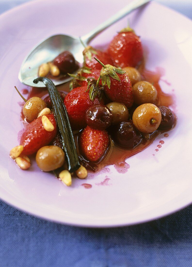 Sautéed strawberries and cherries with pine nuts