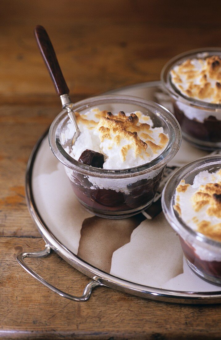 Baked plums with meringue topping