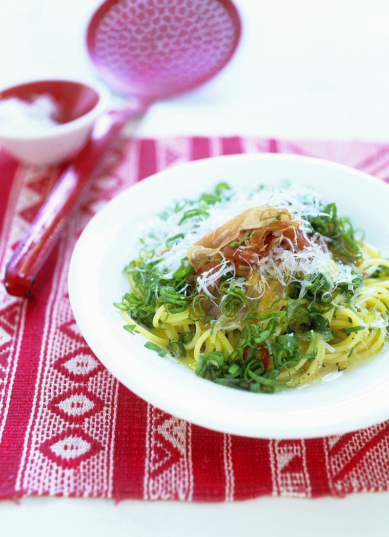 Spaghetti with Parma ham and spring onion rings