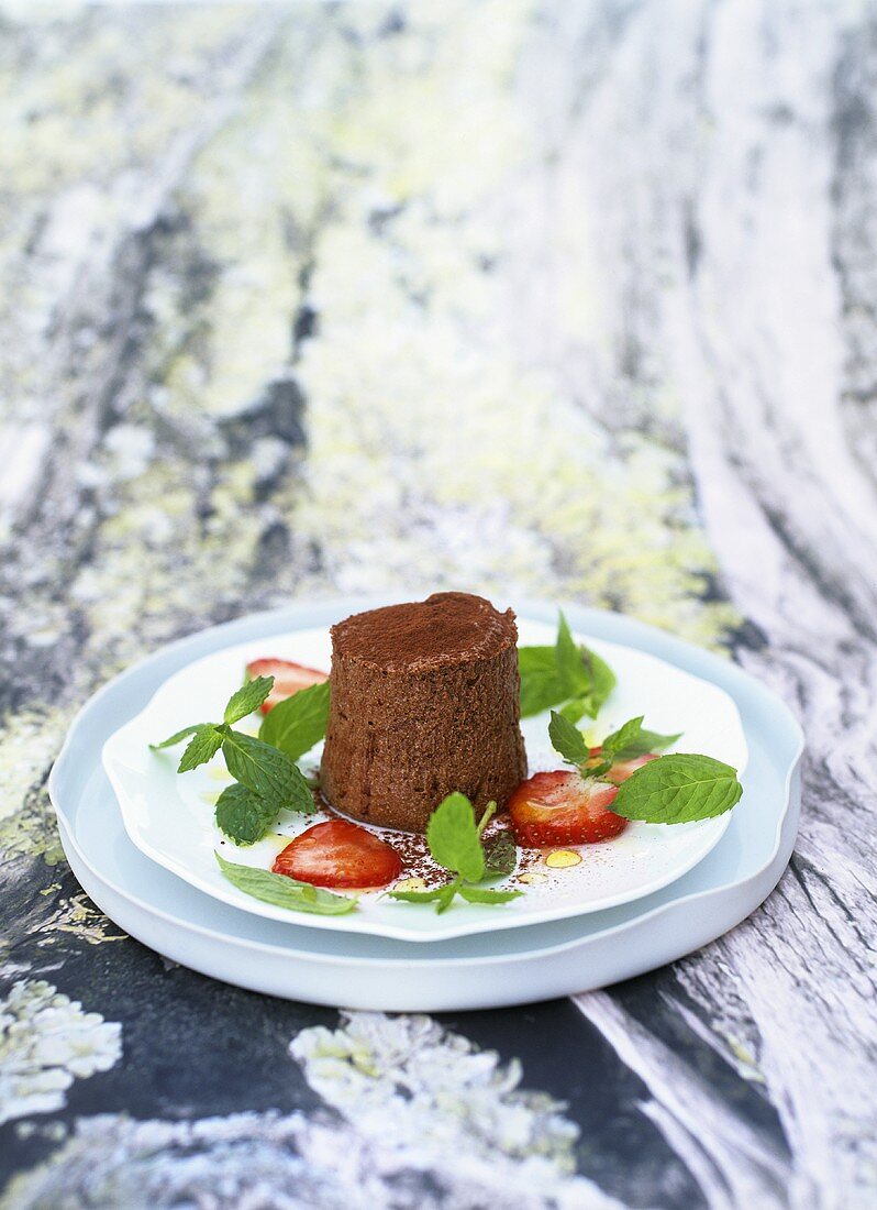 Chocolate mousse with peppermint salad and strawberries