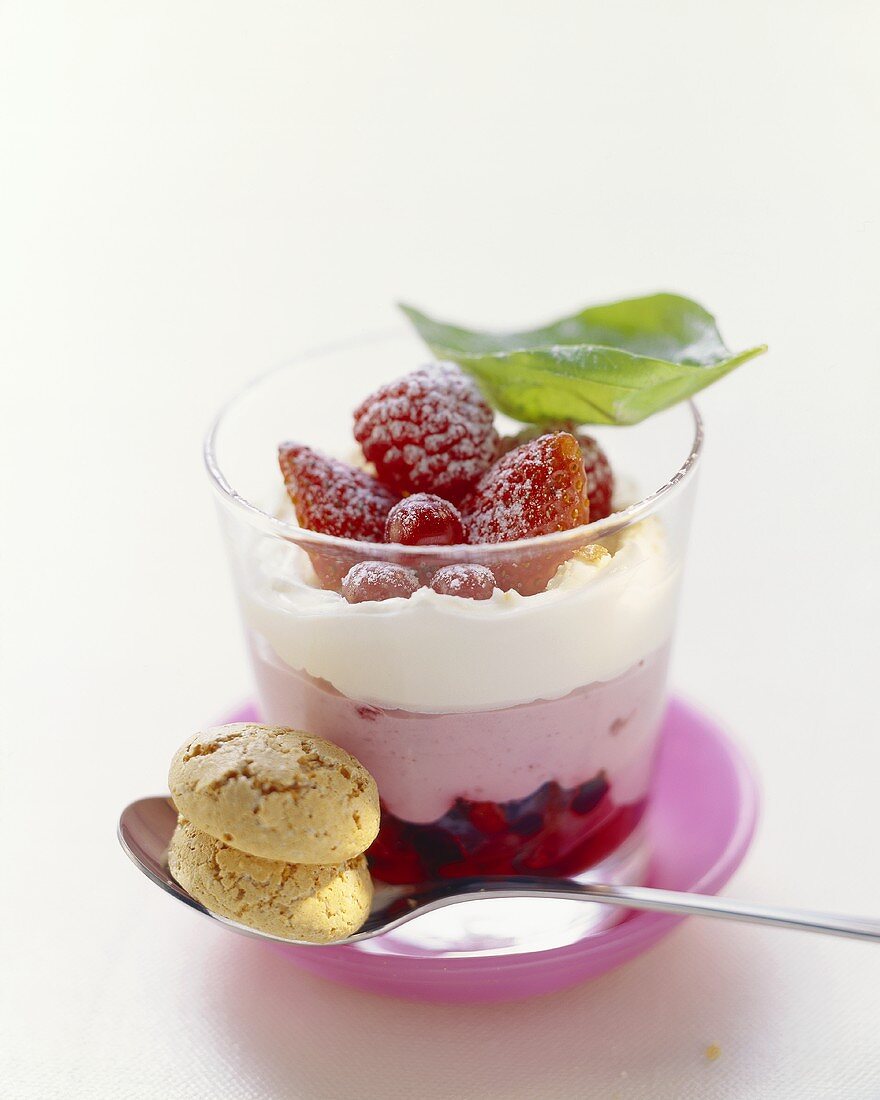 Layered dessert with raspberry cream and cream