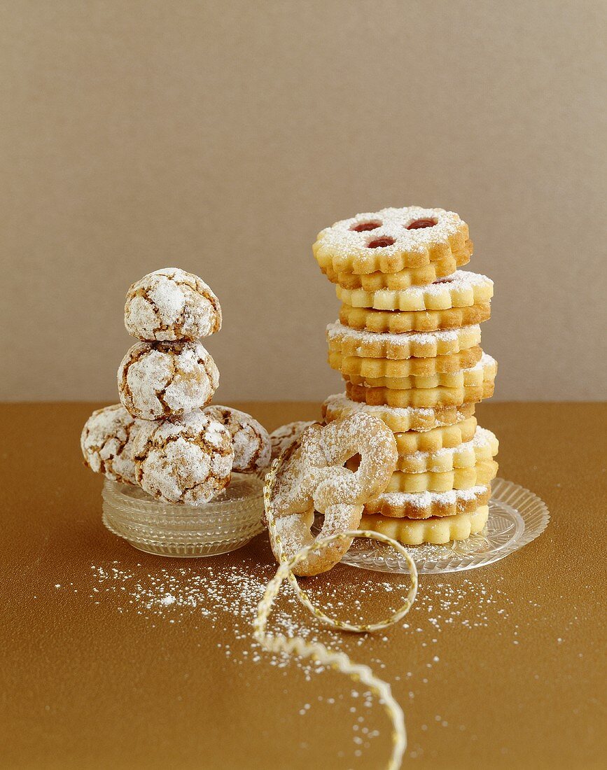 Schusterlaberl (chocolate meringue with icing sugar), almond pretzel and Linzer Augen (nutty shortcrust jam sandwich biscuits with holes on top)