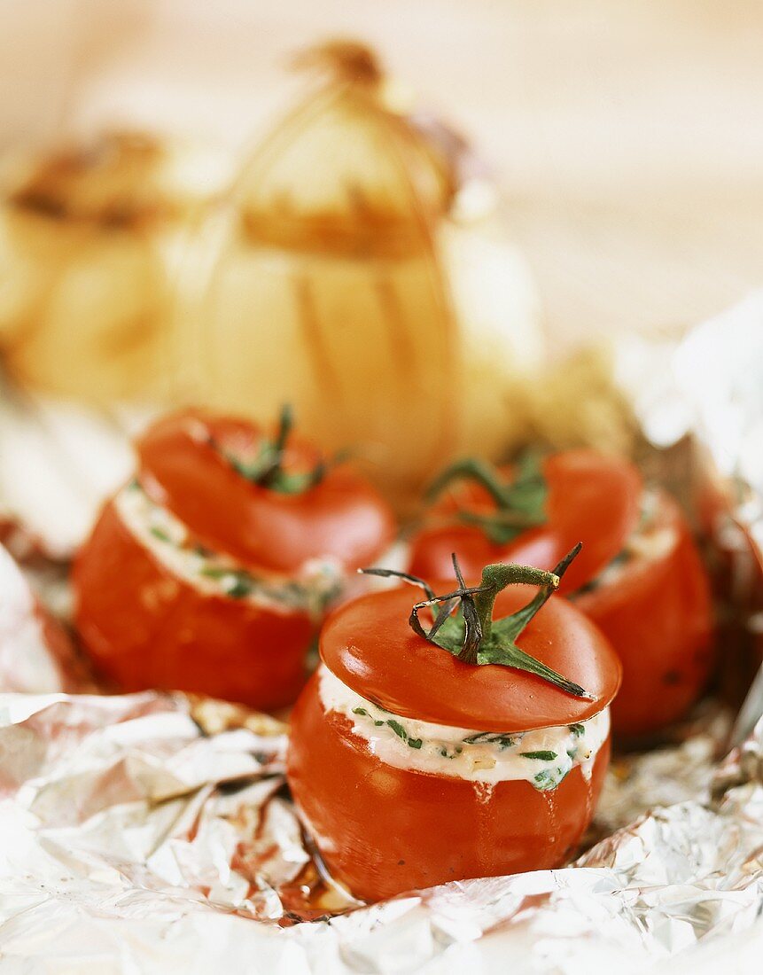 Tomatoes stuffed with ricotta and onions stuffed with bread
