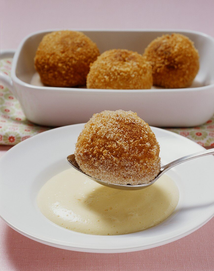 Kartäuserklösse (Franconian French-toast balls) in a white wine foam