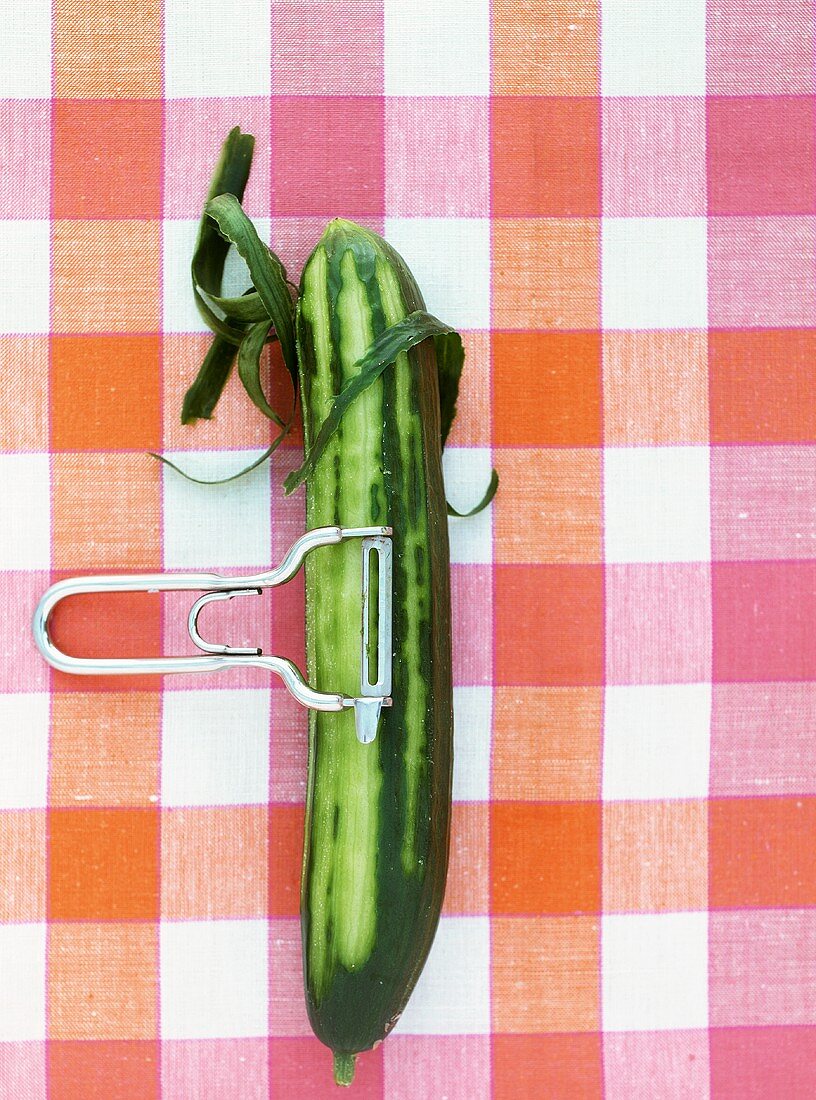 A half peeled cucumber