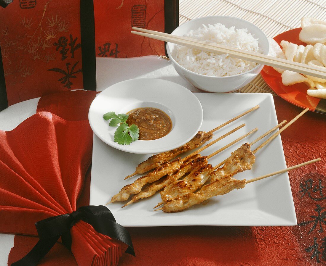 Chicken sate with peanut sauce, rice and prawn crackers