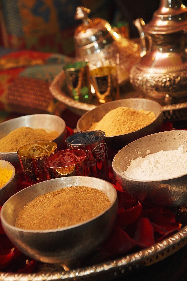 Various spices in dishes (curry, cumin, ginger, coconut)