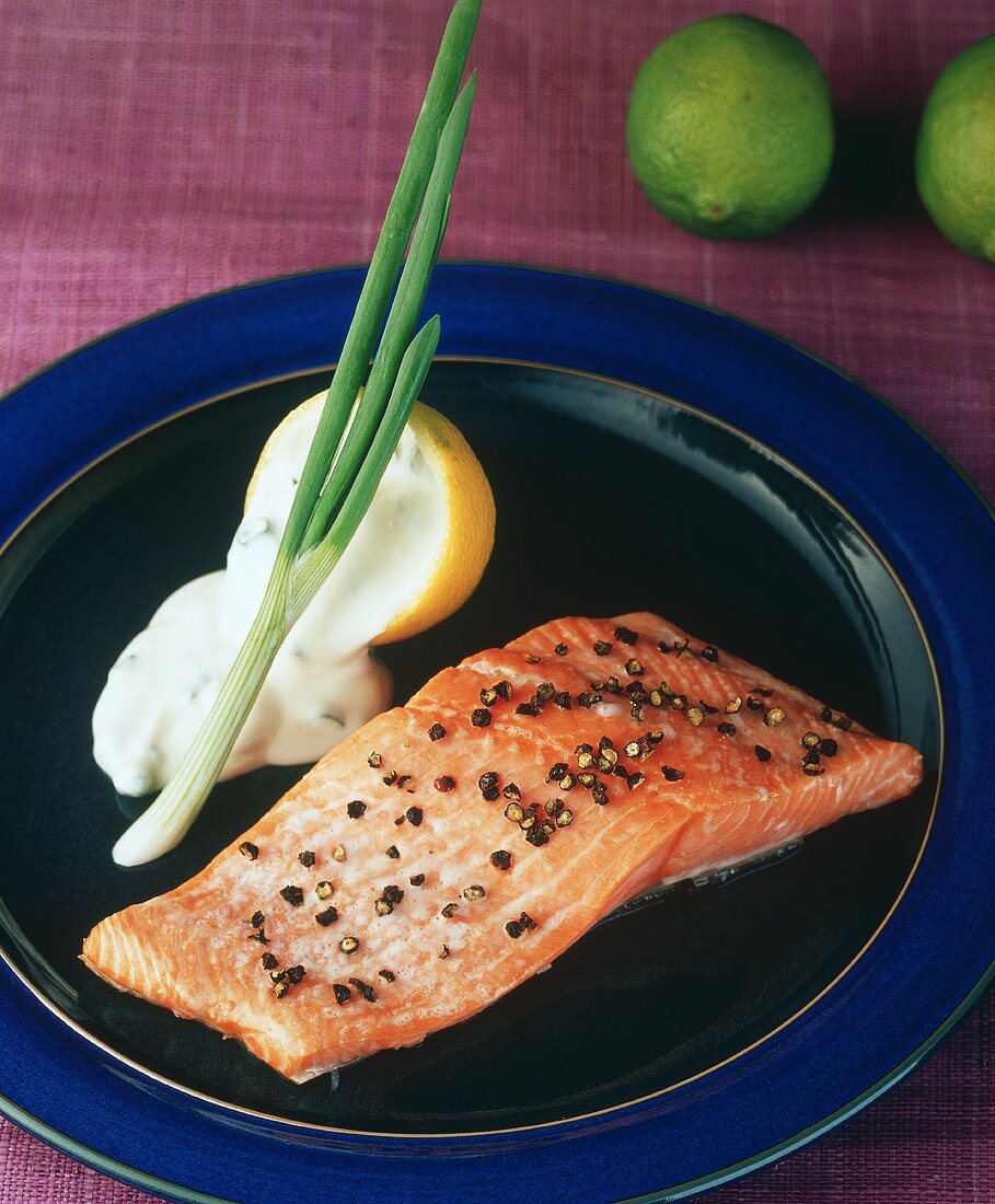 A fillet of salmon with peppercorns and lemon sauce