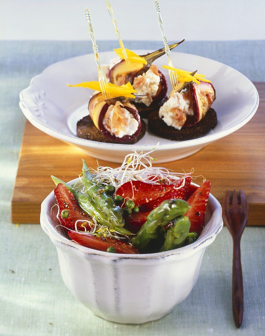 Aubergine rolls with cream cheese and an asparagus and strawberry salad