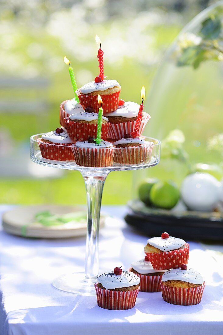 A cupcake pyramid with birthday candles