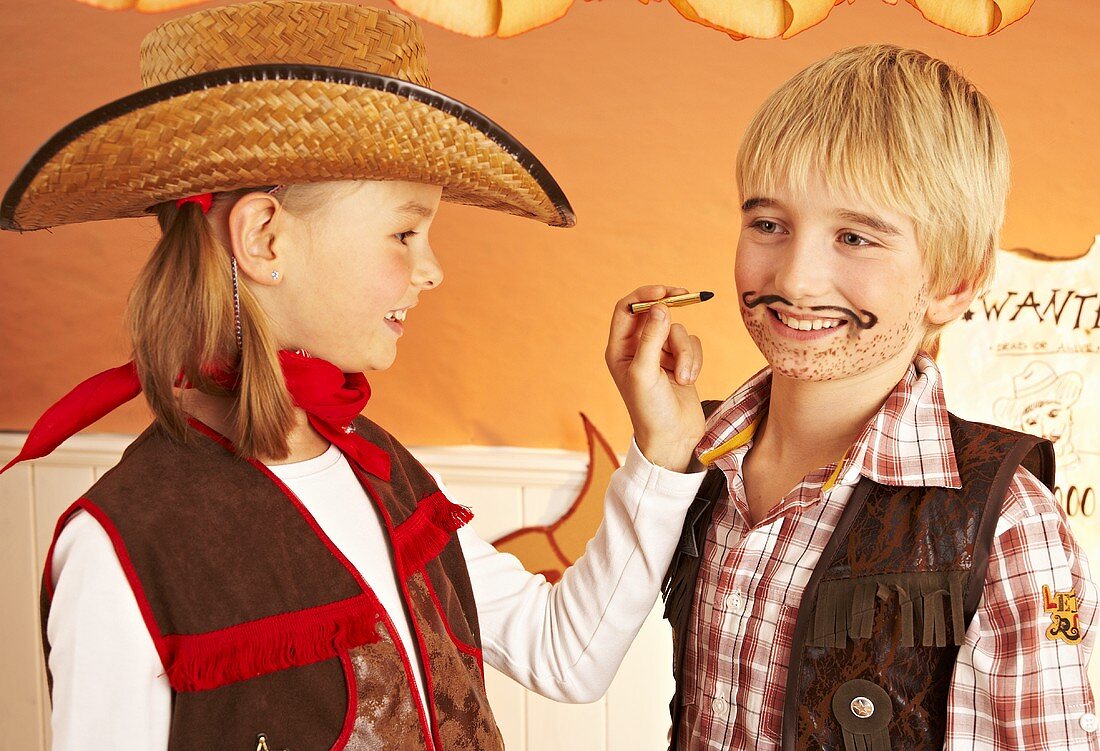 Children painting their faces for a party