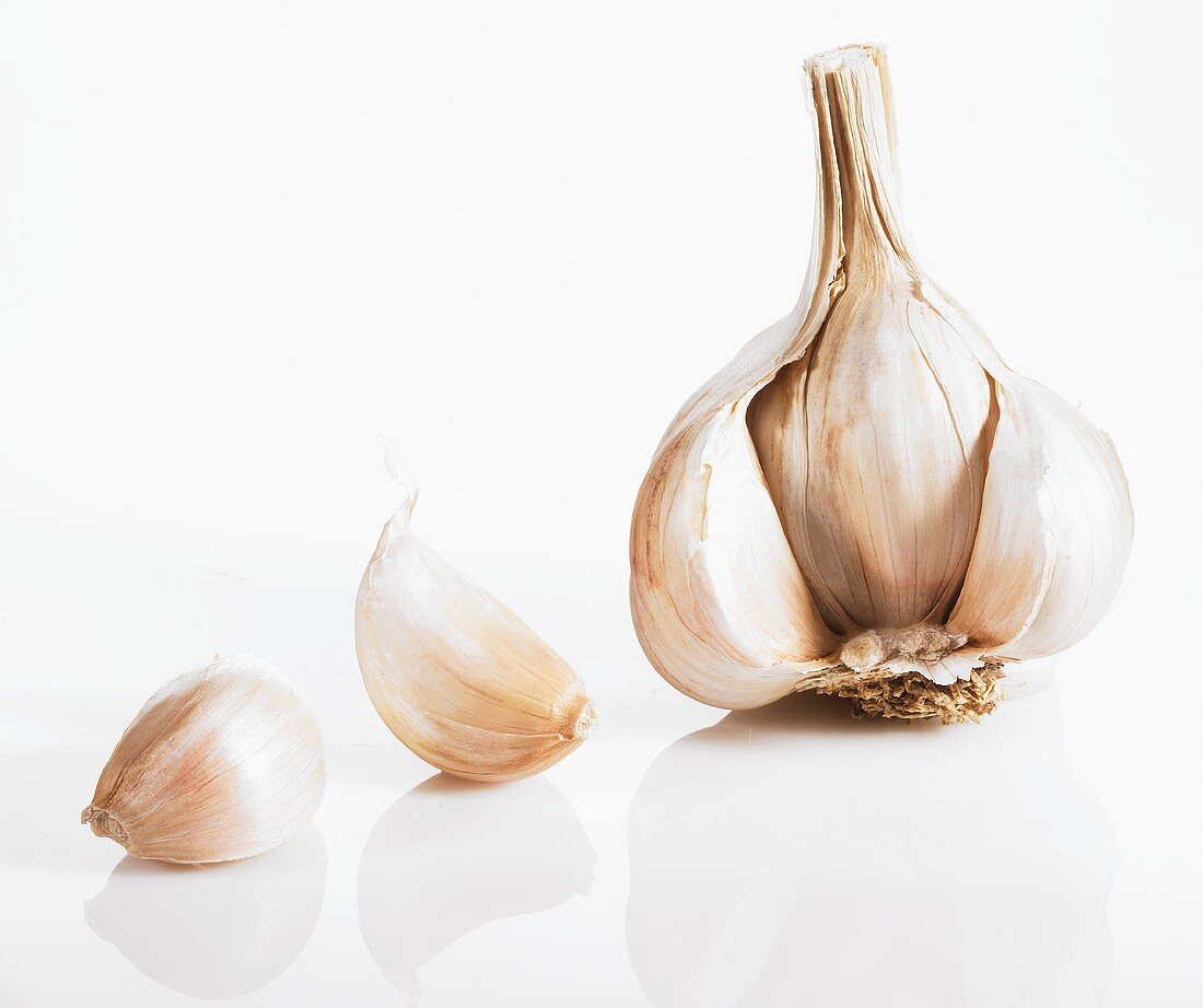 A garlic bulb broken into individual cloves